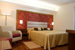 Ένα ή περισσότερα κρεβάτια σε δωμάτιο στο Hotel Villa Cittar