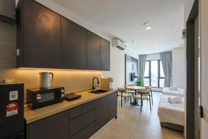 Η κουζίνα ή μικρή κουζίνα στο 22 Macalisterz by Nexx Field