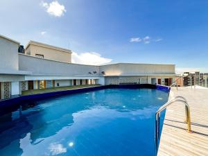 a large swimming pool on the side of a building at Eliana's nyali 3 min to the beach homes in Mombasa
