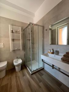 a bathroom with a shower and a toilet and a sink at Dimora in Fiore B&B in Foggia