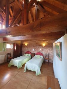 Postel nebo postele na pokoji v ubytování Le Pigeonnier de Roudet