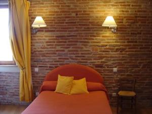 Postel nebo postele na pokoji v ubytování Le Pigeonnier de Roudet