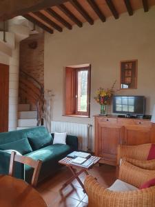 Posezení v ubytování Le Pigeonnier de Roudet