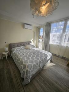 a bedroom with a bed and a large window at La Terrazza in Rome +21 photos