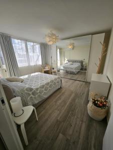 a bedroom with a large bed and a mirror at La Terrazza in Rome