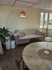 a living room with a couch and a table at La Terrazza in Rome