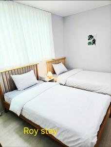 Ένα ή περισσότερα κρεβάτια σε δωμάτιο στο Roy Stay Suwon Haenggung