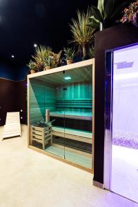 a glass cabinet with plants on top of it at Al Giordano in Piazza in Foggia
