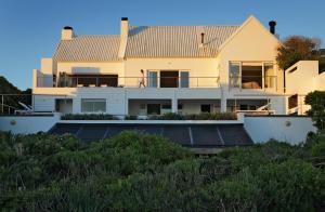 a house with solar panels in front of it at Blanc de Blanc in Yzerfontein