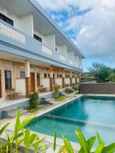 an image of a hotel with a swimming pool at Ulu Khandra Homestay in Bingin Beach