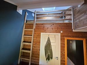 a loft bed in a tiny house at Charming apartment with lodgefeeling in Hemsedal +6 photos