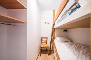 Una cama o camas en una habitación de Studio 5 - L'Épilobe