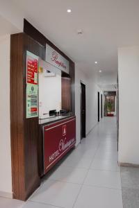 a corridor of a hotel with a food counter at HOTEL VINTAGE Inn in Vadodara