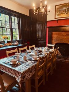 a dining room with a table and chairs at Langley House in Langley