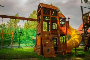 a playground with a slide and a play structure at Chata Roubenka in Sedloňov