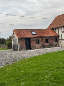 an old brick building with a skylight at A la ferme - Colline Beaumont in Colline-Beaumont