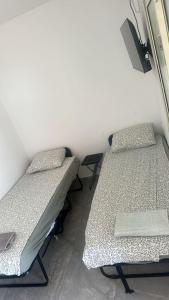 a room with two beds in a room at הרמוני סוויט harmony suite in Neve Zohar +1 photo
