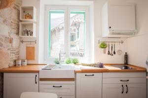 Kuchyň nebo kuchyňský kout v ubytování Apartment Barone