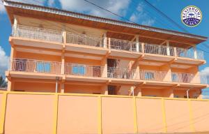 a building with balconies on the side of it at Residhome ACACIA in Moanda