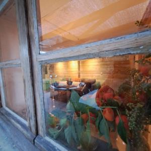 a view of a room through a window at Coume a Case - Gîte 4 étoiles - Charme et nature Vallée d Ossau in Lys