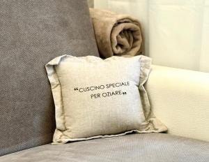 a pillow sitting on top of a bed at Casa Telli - da Merilù in Turin