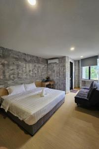 Ένα ή περισσότερα κρεβάτια σε δωμάτιο στο The Cozy Hotel