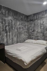 Ένα ή περισσότερα κρεβάτια σε δωμάτιο στο The Cozy Hotel +11 φωτογραφίες