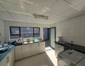a kitchen with a sink and a counter top at LaPeroge Home in Ballito