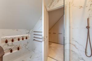 a bathroom with a shower and a glass door at 6 Bed in Ainsdale oc-w33455 in Ainsdale +32 photos