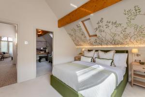 a bedroom with a large bed with white walls at 6 Bed in Ainsdale oc-w33455 in Ainsdale