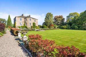 an old house with a large lawn in front of it at 5 Bed in Errol oc-t33381 in Errol