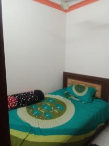 a bedroom with a bed with a plate on it at Hotel Sadiq Residential in Dhaka +7 photos
