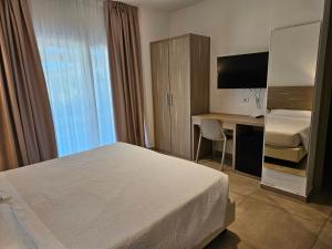 Телевизор и/или развлекательный центр в Hotel Onda Marina