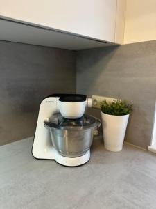 a mixer sitting on a counter with a bowl on it at Weitblick Neviges in Velbert