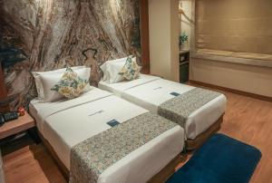 Postel nebo postele na pokoji v ubytování Planet Boutique Hotel