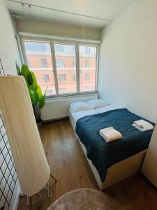 a bedroom with two beds and a large window at Copenhagen Studio Double Bed and Kitchen 3 in Copenhagen