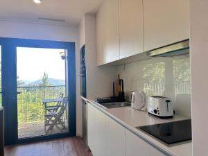 Nhà bếp/bếp nhỏ tại Bungalows da Travanca