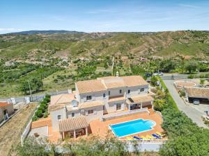 an aerial view of a house with a swimming pool at Casa Vista Cumeada in Canhestros