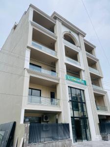 a building with a sign on the side of it at Limewood Signature - Golf Course Road in Gurgaon