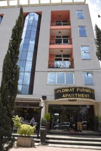 a building with a sign that reads fulham furnished apartment at Diplomat Furnished Apartments in Addis Ababa