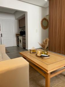 a living room with a coffee table and a kitchen at Modern Boho Chalet in Central Sharm El Sheikh in Sharm El Sheikh