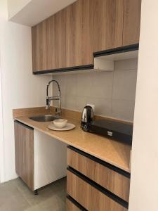 a kitchen with a sink and a plate on a counter at Modern Boho Chalet in Central Sharm El Sheikh in Sharm El Sheikh +13 photos