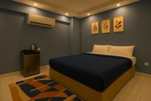 a bedroom with a bed and a air conditioner at Upora Pyramids View Inn in Cairo