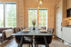 a dining room with a table and chairs at Levi Kätkänlinna 20A by Holiday in Lapland in Kittilä +38 photos