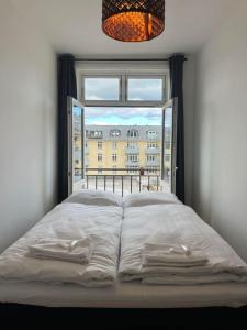 Ένα ή περισσότερα κρεβάτια σε δωμάτιο στο Charming Hellerup Residence +19 φωτογραφίες
