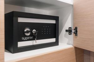 a room with a safe with a key in it at Dione Catamaran in Thessaloniki
