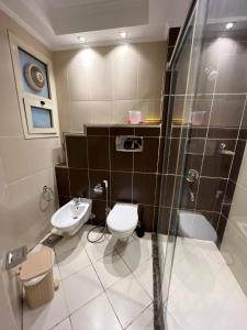 a bathroom with a toilet and a sink at One bedroom old town tawaya Sahel hashish in Hurghada