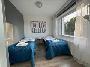 Ένα ή περισσότερα κρεβάτια σε δωμάτιο στο Apartment Rovaniemi Center 8 +5 φωτογραφίες