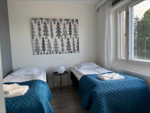 Ένα ή περισσότερα κρεβάτια σε δωμάτιο στο Apartment Rovaniemi Center 8