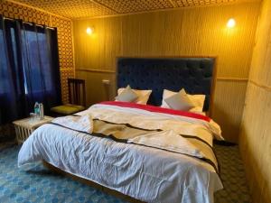 Katil atau katil-katil dalam bilik di Alpine Cottage Pangong